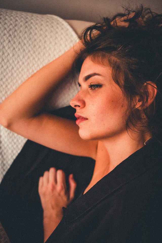 woman lying on the bed